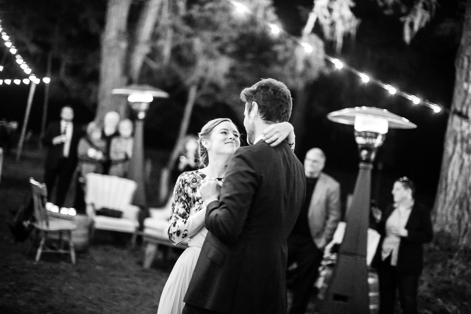 Black and white photo of Groom and bride dancing