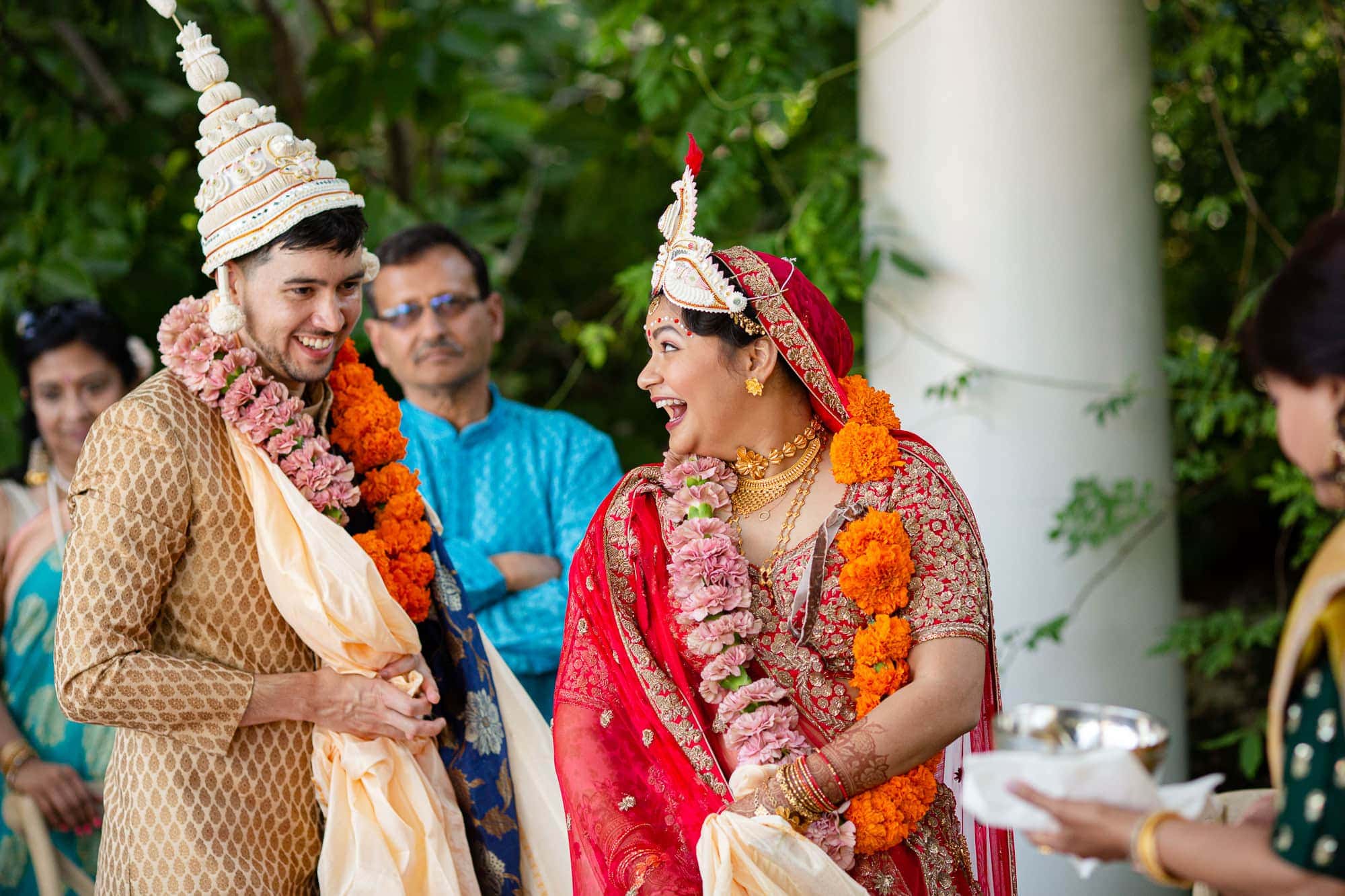 Indian wedding ceremony bride and groom laughing