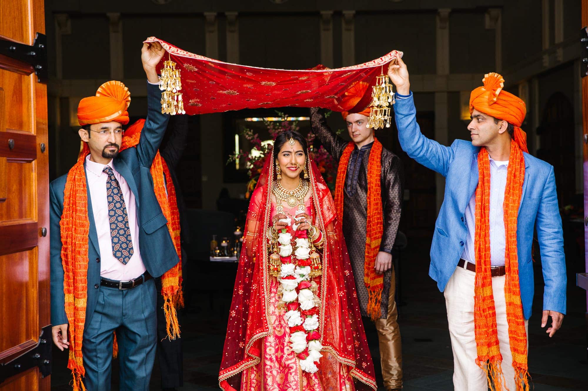 Traditional Indian wedding ceremony celebration with red and orange details in Pleasanton winery