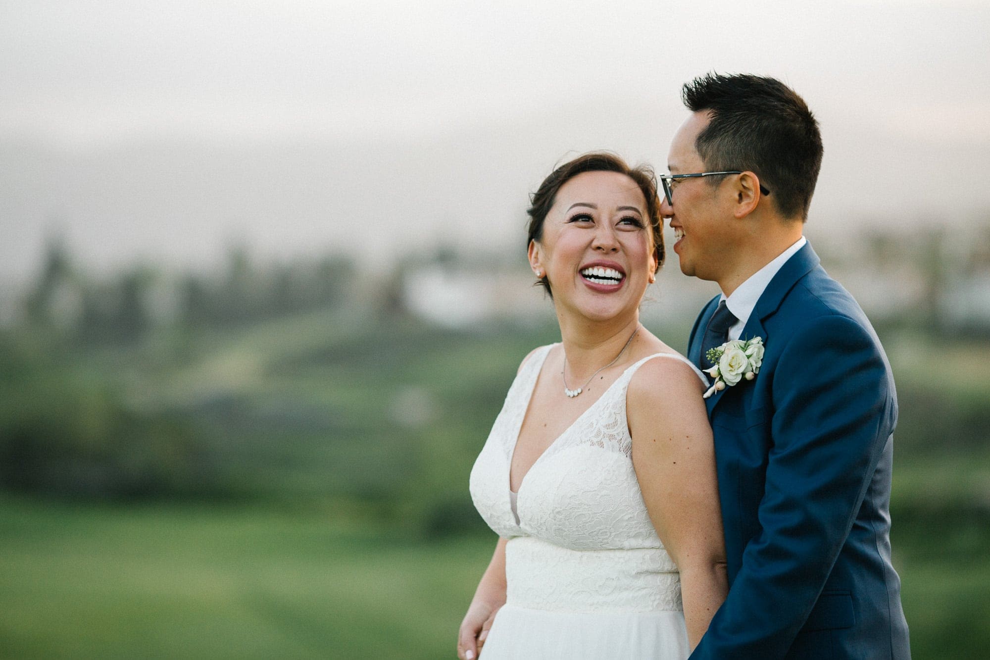 Bride and groom couples photos at sunset overlooking green hills in San Ramon