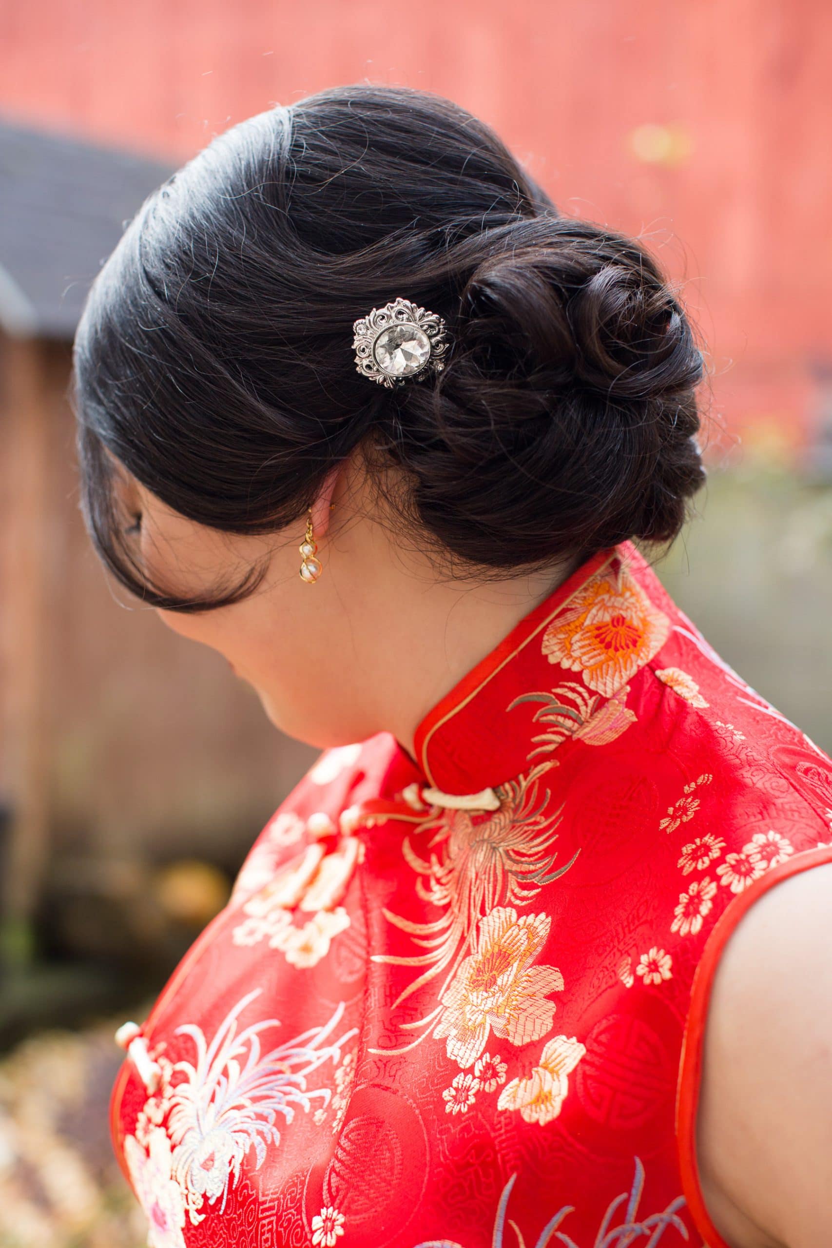 detail of brides hair in her qipao