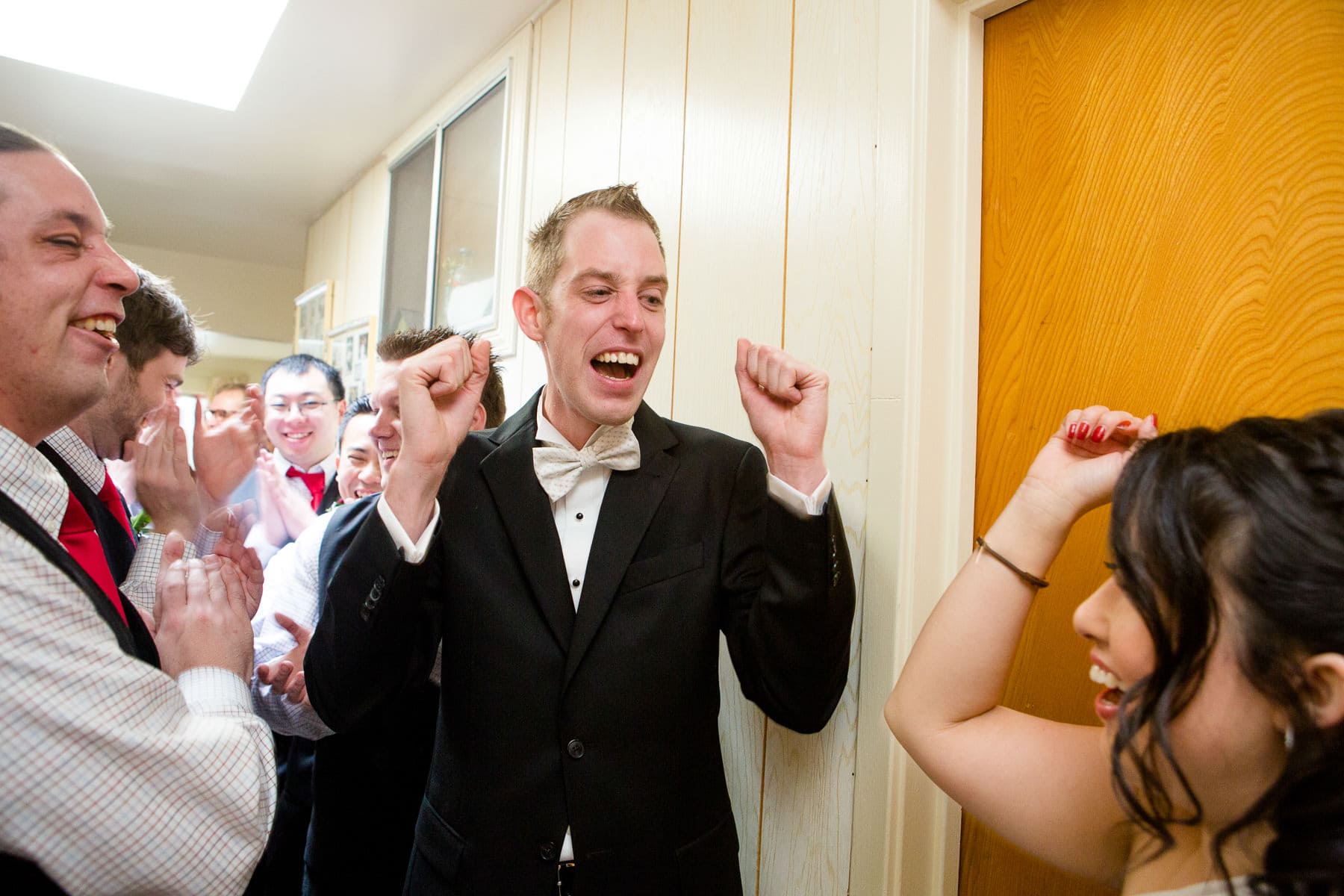 Groom celebrating after answering door games questions