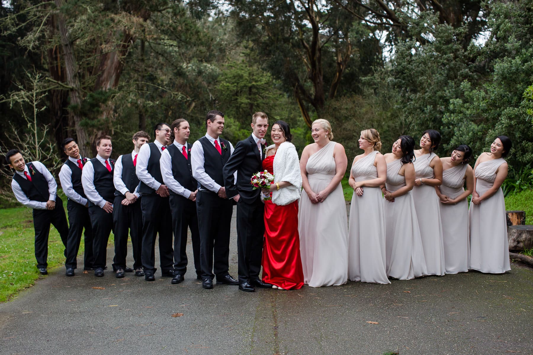 Bride and groom with their bridal party outdoors
