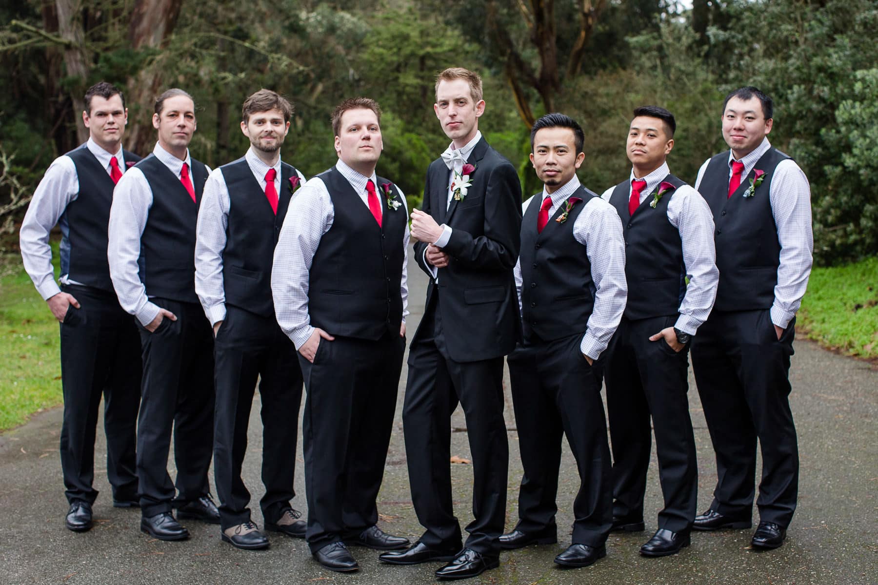 Groom and groomsmen posing outdoors in Golden Gate Park