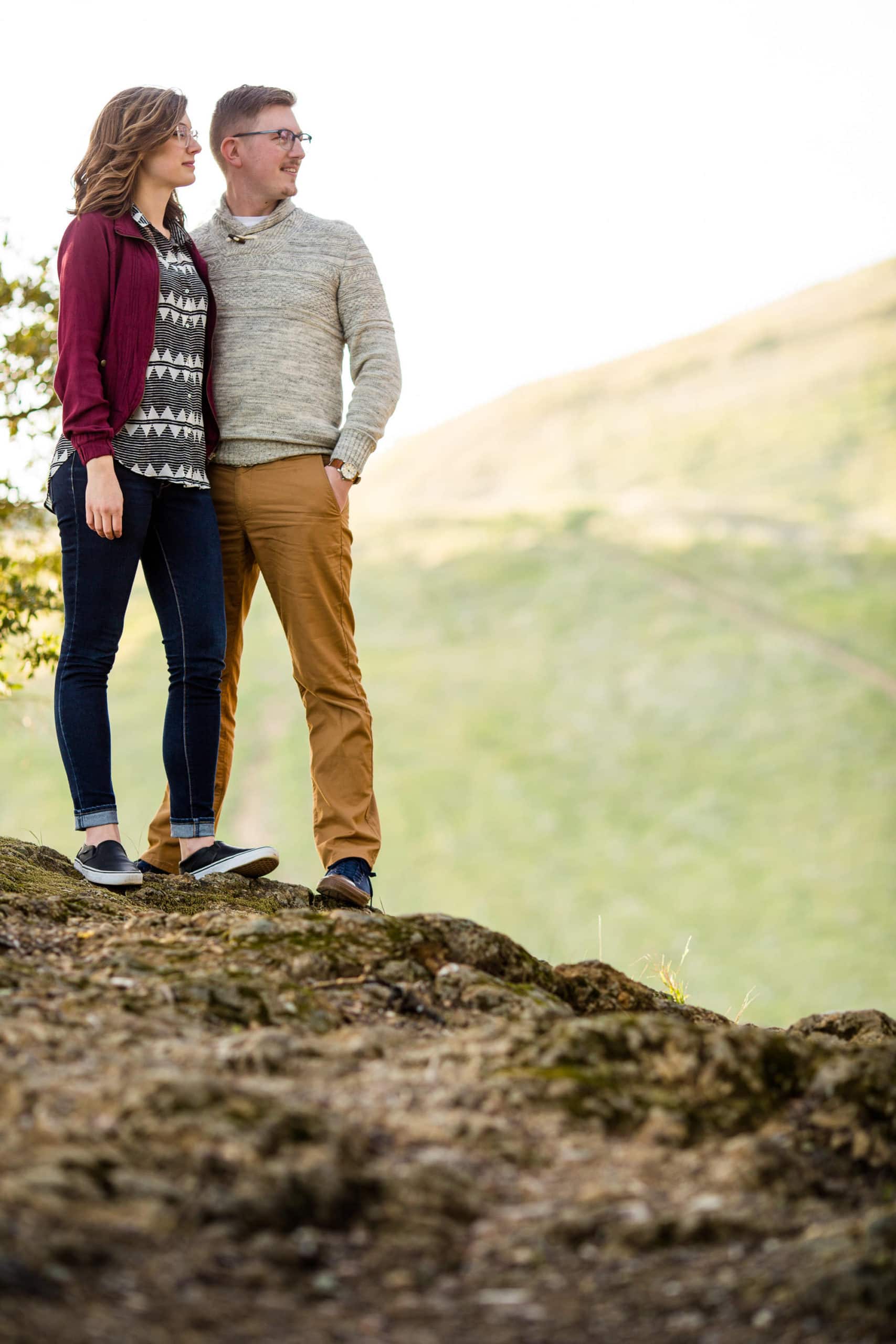 Couple standing on a rock looking at the view